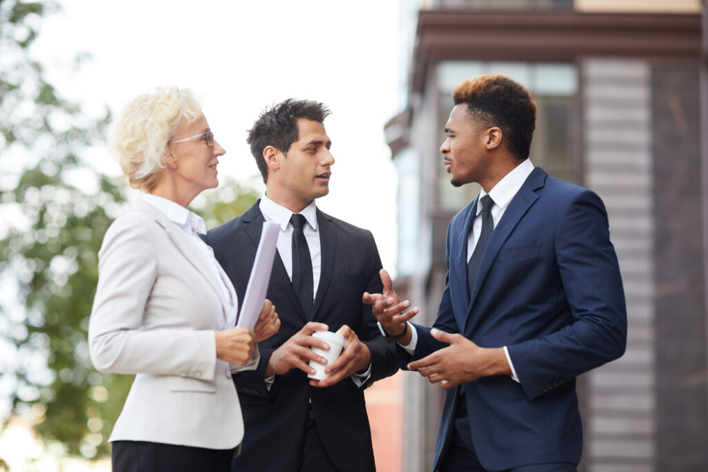 Two marketing professionals conducting a direct outreach with a client.